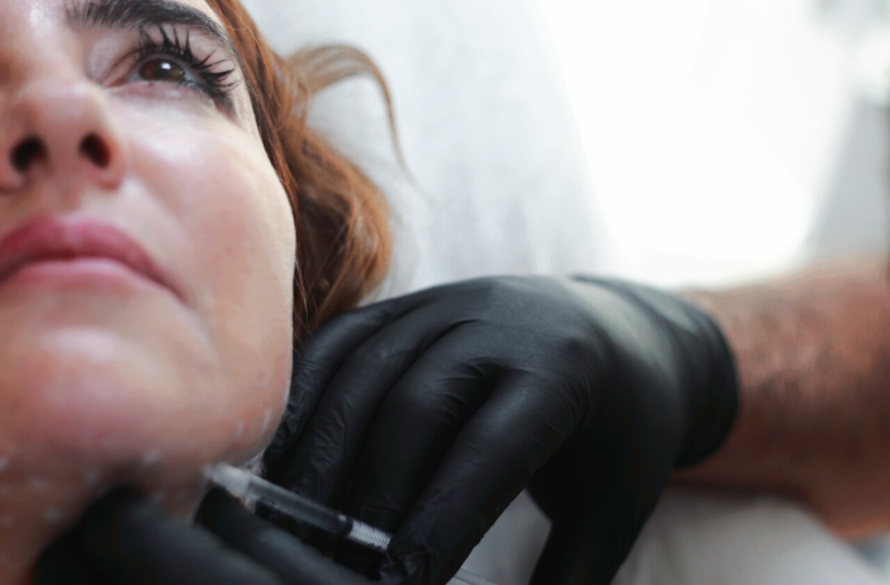 woman getting botox injection on face